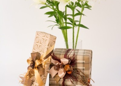 Floral Art White lilies in gift boxes with bows and ribbons, perfect for trousseau packaging.